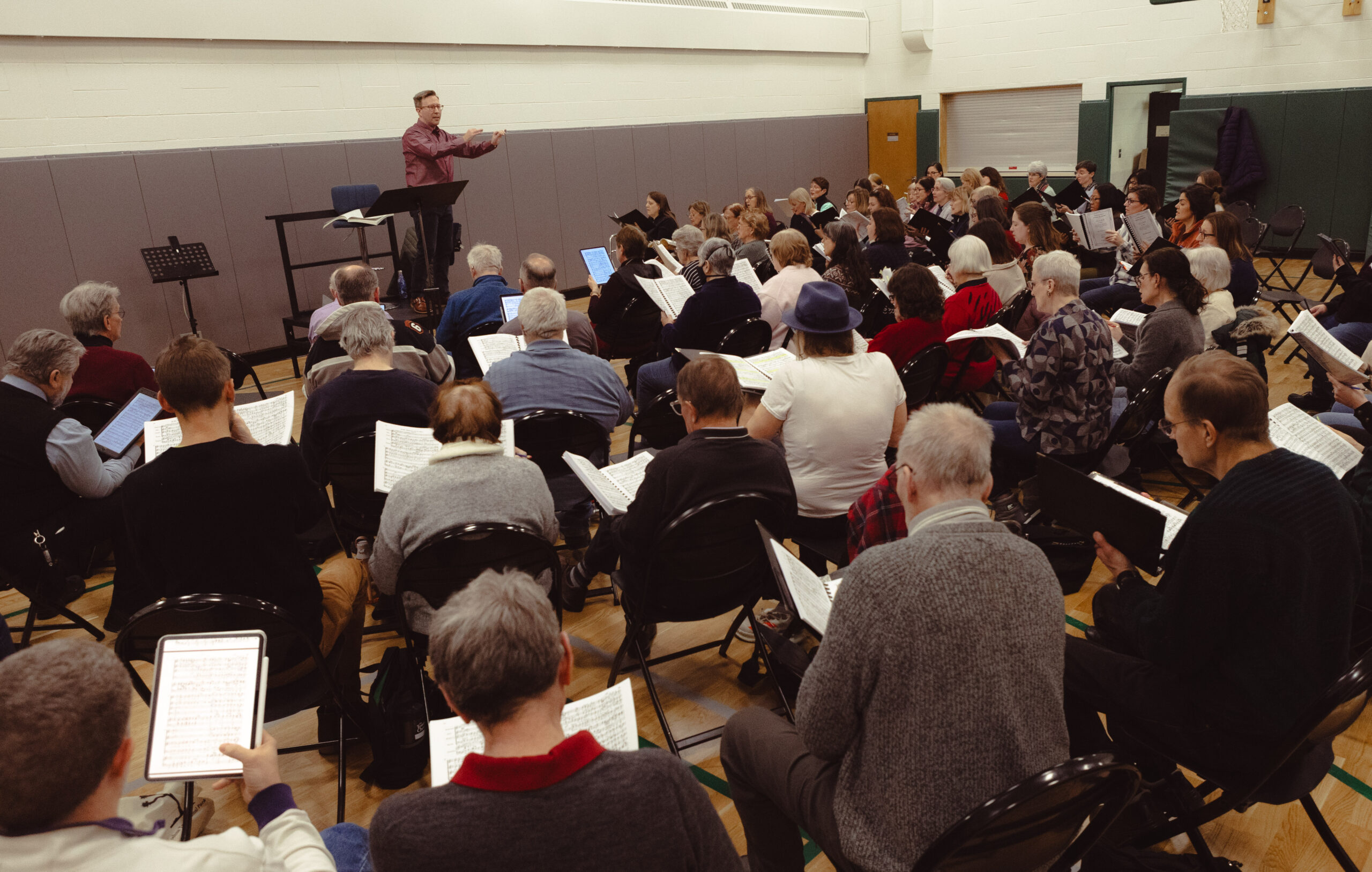 Tower Chorale and its director, Patrick Godon, in rehearsal