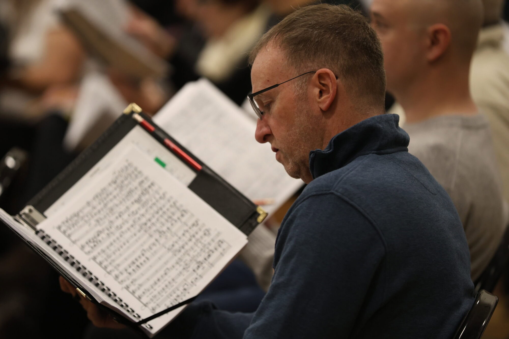 Tower chorale singers, focused at rehearsal