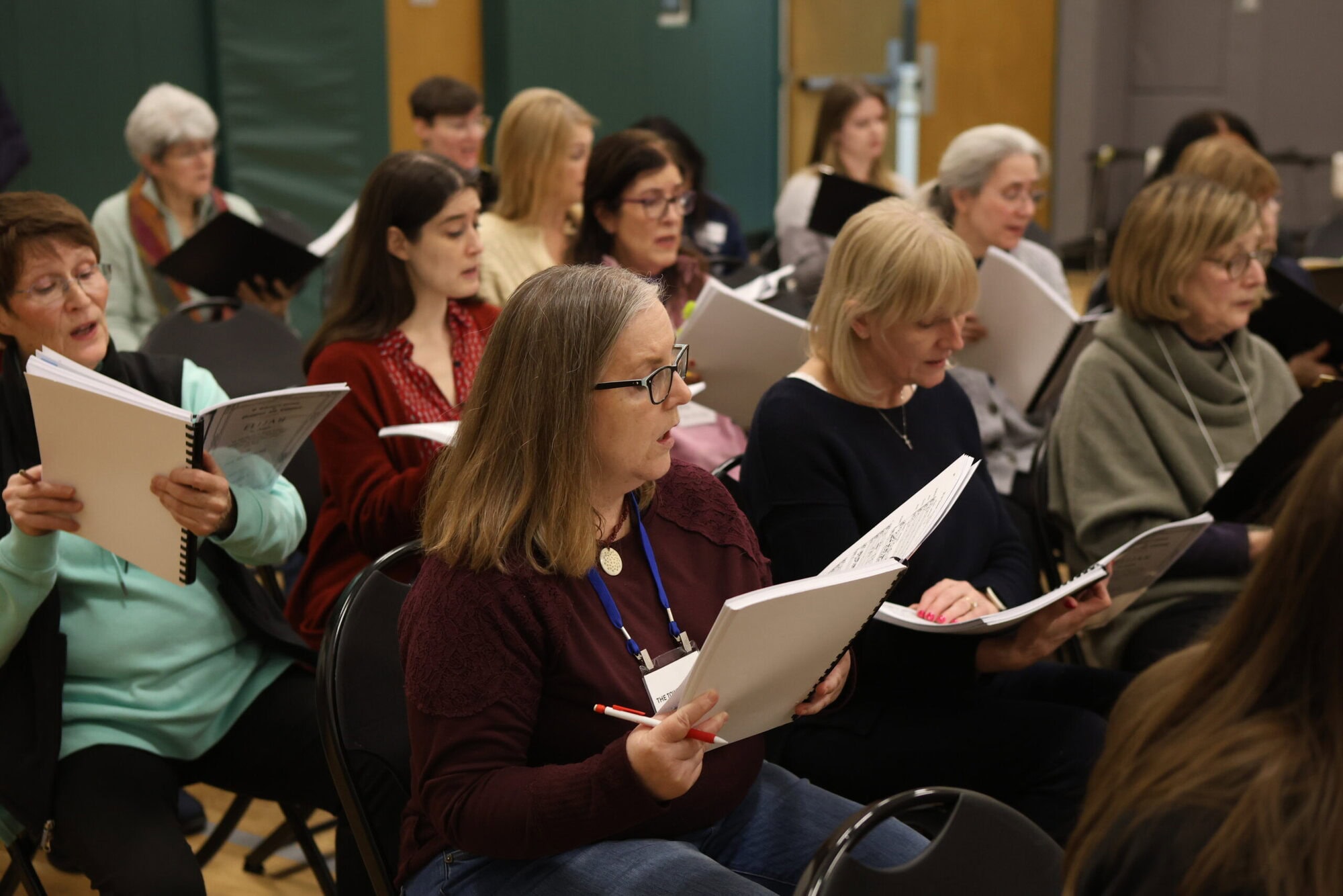 Tower Chorale singers in serious rehearsal preparation